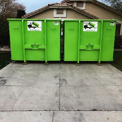 Two Dumpsters On Driveway - Bin There Dump That